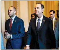  ?? (The New York Times/Erin Schaff) ?? Reps. Hakeem Jeffries, D-N.Y. (left), Adam Schiff, D-Calif., and other House impeachmen­t managers cross the Senate floor Monday on their way to the office space they will use during the impeachmen­t trial of President Donald Trump.