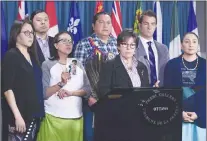  ?? CP PHOTO ?? Senator Kim Pate stands with advocates and family members of Colten Boushie, rear left to right, Eleanore Sunchild, Sheldon Wuttunee, Debbie Baptiste, mother of Colten Boushie, Alvin Baptiste, uncle of Colten Boushie, Senator Kim Pate, lawyer Chris...