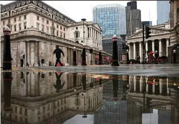  ??  ?? Financing concerns: The BOE building in London. The unpreceden­ted surge in borrowing by government­s during the pandemic has prompted some economists to suggest that central banks are directly financing spending and would struggle to raise interest rates even when the crisis is over.