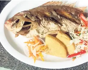  ??  ?? Fried snapper with escovietch sauce on the side and fried bammy.