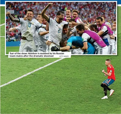  ?? GETTY IMAGES ?? Tsar of the show: Akinfeev is mobbed by his Russian team-mates after the dramatic shootout