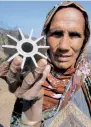  ?? PTI ?? A woman showing parts of mortar shells fired from the Pakistani side at village Panjgrain in Rajouri. —