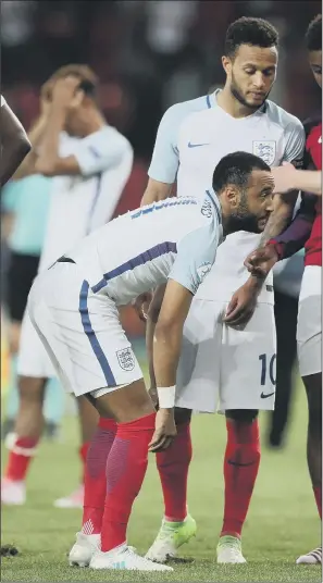  ??  ?? Nathan Redmond looks dejected after his missed penalty meant England exited the European Under-21 Championsh­ips on penalties to their nemesis Germany at Stadion Miejski, Tychy.