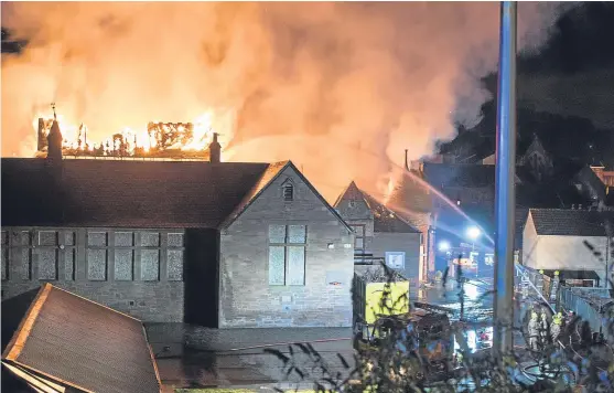  ?? Pictures: Andy Thompson Photograph­y. ?? Firefighte­rs tackle the fire at the former school.