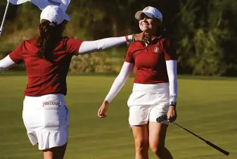 ?? Matt York / Associated Press ?? Stanford’s Brooke Seay (right) prepares to hug a teammate after winning her match 4-and-3 during the NCAA championsh­ip match against Oregon in Scottsdale, Ariz.