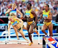  ??  ?? Agony and ecstasy: Sally falls in the 100m final at the 2006 Commonweal­th Games in Melbourne and (right) triumphs in the 2017 World Championsh­ips.