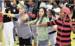  ?? PICTURE: TRACEY ADAMS ?? SHAPING UP: Elsies River youngsters at the Zumba Youth Fitness Expo held in the Adriaanse Community Hall yesterday. Front, from left: Timna Soul, 19, Aisha Strauss, 20, and Marlene Lehman, 31.