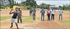  ?? HT PHOTO ?? A participan­t throws a shot put during the district-wise police recruitmen­t process of local tribal youths in Bastar.