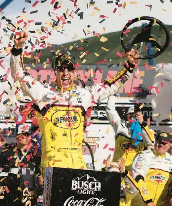 ?? JOHN LOCHER/AP ?? Joey Logano celebrates after winning Sunday’s NASCAR Cup playoff race at Las Vegas Motor Speedway.