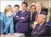  ?? Jesco Denzel EPA/Shuttersto­ck ?? PRESIDENT TRUMP meets with German Chancellor Angela Merkel, left, Japan’s Shinzo Abe and other world leaders at the Group of 7 summit in June.