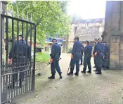  ??  ?? Ewan Ireland, right, used a screwdrive­r he had stolen minutes earlier to stab Peter Duncan. Left, police search the grounds of a church following the attack