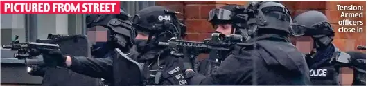  ?? ?? Tension: Armed officers close in