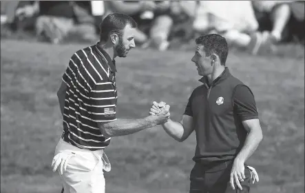  ?? AP ?? Dustin Johnson (left) and Rory McIlroy, pictured at the 2018 Ryder Cup in France, headline a $3 million charity match for COVID-19 relief on May 17 that will mark the return of live golf to television.
