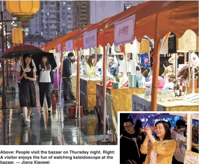  ??  ?? Above: People visit the bazaar on Thursday night. Right: A visitor enjoys the fun of watching kaleidosco­pe at the bazaar. — Jiang Xiaowei