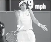  ?? BEN CURTIS/AP ?? Garbine Muguruza shows her frustratio­n during her second-round loss to Alison Van Uytvanck on Thursday.