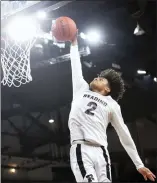  ?? BEN HASTY — MEDIANEWS GROUP ?? Reading High’s Ruben Rodriguez dunks for two of his 22points during the Red Knights’ victory over the Saints.