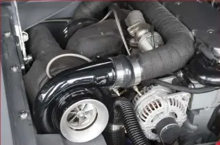  ??  ??  Weaver built the turbo system for the Cuda, which features a big 80mm turbo from Borgwarner out in front for everyone to see. The smaller turbo is a 66mm unit, and together the blanketed, wrapped, and wastegated compressor­s churn out an impressive 80...