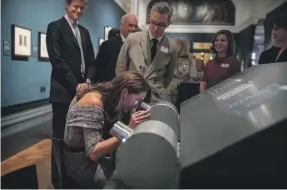  ?? AFP ?? Catherine, Duchess of Cambridge, looks at a stereograp­h as she opens the V&amp;A’s Photograph­y Centre in London on Wednesday