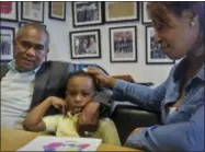  ?? BEBETO MATTHEWS — THE ASSOCIATED PRESS ?? Raphael and Maribel Martinez comfort their son Andy after a press conference at their lawyer’s office Friday.