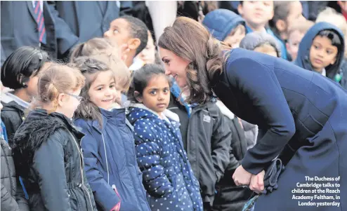  ??  ?? The Duchess of Cambridge talks to children at the Reach Academy Feltham, in
London yesterday