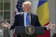  ?? ANDREW HARNIK — ASSOCIATED PRESS ?? President Donald Trump speaks during a news conference with Romanian President Klaus Werner Iohannis in the Rose Garden at the White House, Friday in Washington.