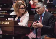  ?? Jessica Hill / Associated Press ?? House Minority Leader Themis Klarides, R-Derby, left, talked with Senate Minority Leader Len Fasano, R-North Haven, in a 2019 file photo.