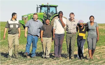  ?? Pictures: ESA ALEXANDER ?? IN STEP: Daniel Pieters, Kosie van Zyl, Gavin Jaars, Marius Engel, crop specialist Piet Blom, Lena Jaars and Margaret Engel. The Agri Dwala group has already produced tons of barley and wheat