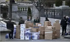  ?? Photograph: Gerald Herbert/AP ?? Stacks of boxes taken out of the White House complex on Thursday. There is growing concern that Trump’s records will not be complete.