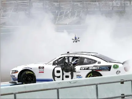  ?? WILFREDO LEE — THE ASSOCIATED PRESS ?? Chase Briscoe does a burnout after winning a NASCAR Xfinity Series auto race Sunday, June 14, 2020, in Homestead, Fla.