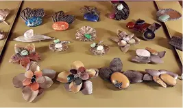  ??  ?? Brooches and pendants by artist Kavita Singh