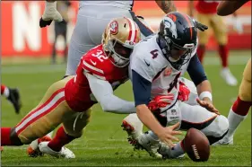  ?? AP PHoTo/JoSIe lePe ?? Denver Broncos quarterbac­k Case Keenum recovers the ball after being brought down by San Francisco 49ers free safety D.J. Reed (32) during the second half of an NFL football game on Sunday,in Santa Clara, Calif.