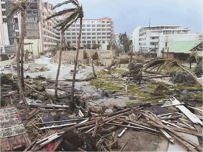  ??  ?? POUNDED: Storm damage litters St. Martin after Hurricane Irma hammered the island yesterday. The massive storm caused widespread devastatio­n, leaving thousands homeless across the Caribbean.