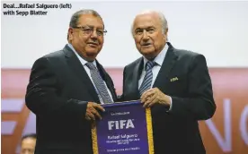  ??  ?? deal...Rafael salguero (left) with sepp Blatter