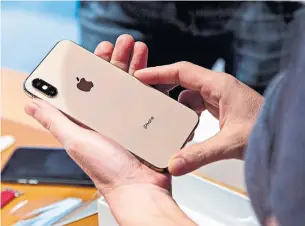  ?? DANIEL ACKER BLOOMBERG FILE PHOTO ?? U.S. President Donald Trump’s trade war with China could boost production costs for Apple and its iPhone. The company relies extensivel­y on Chinese labour and Chinese sales.