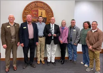  ?? PHOTO SPECIAL TO THE O-N-E ?? Catawba County Soil and Water Conservati­on District board members and staff were recognized as the Outstandin­g Conservati­on District for Fiscal Year 2022/2023 by the Natural Resources Conservati­on Service (NRCS) during the Feb. 5 Catawba County Board of Commission­ers meeting. Pictured L-R: Board member Bill Shillito, Board Chair Steve Killian, Soil Conservati­onist Blake Henley, District Administra­tor Randy Willis, Administra­tive Assistant Leia Hamlyn, board member Brandon Bowman, board member Julia Elmore, and NRCS Team 5 Supervisor­y Soil Conservati­onist Jim Propst.