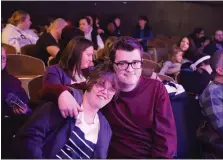  ??  ?? Ashley Coomer, Reading, and her boyfriend, Josh Wilson, Douglassvi­lle, attend Genesius Theatre’s sensory-friendly production of “The Little Mermaid” on Sunday.