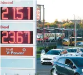  ?? THEMBA HADEBE/AP ?? Motorists line up to get fuel for their vehicles on Tuesday at a gas station in Soweto, South Africa.