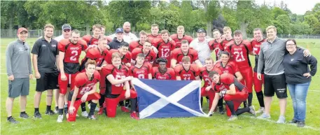  ??  ?? Three-in-a-row East Kilbride Pirates’junior team celebrate another league championsh­ip success with their coaches