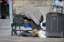  ?? STUART CAHILL — BOSTON HERALD ?? The state will be keeping open Boston’s South Station for people who are homeless during the city’s cold weather emergency.