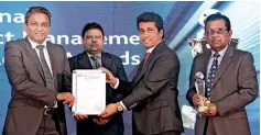  ??  ?? Maga Assistant General Manager and Project Manager Saman Indrajith Mahawatta and Engineerin­g Director and Project Director Asoka De Silva receiving the award from Sri Lanka Telecom PLC Chief Executive Officer Kiththi Perera and Sri Lanka Telecom PLC...