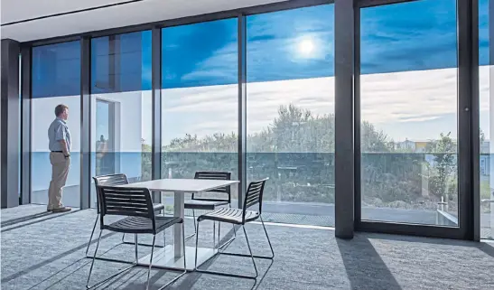  ?? SAGEGLASS ?? By tinting as needed throughout the day, SageGlass’s smart windows create indoor spaces that people love — unobstruct­ed by blinds or shades.