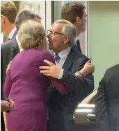  ?? — AP ?? European Commission President Jean-Claude Juncker, center right, embraces British Prime Minister Theresa May, center left, after a meeting at EU headquarte­rs in Brussels on Monday.
