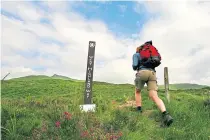  ??  ?? A walker on the West Highland Way