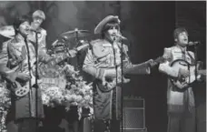  ?? PAUL COLTAS ?? Reuven Gershon, far right, plays John Lennon in