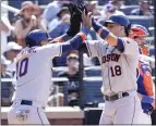  ?? MARY ALTAFFER – THE ASSOCIATED PRESS ?? The Astros' Jason Castro, right, celebrates with Yuli Gurriel, who scored on Castro's goahead, two-run homer in the top of the ninth inning against the Mets on Wednesday.