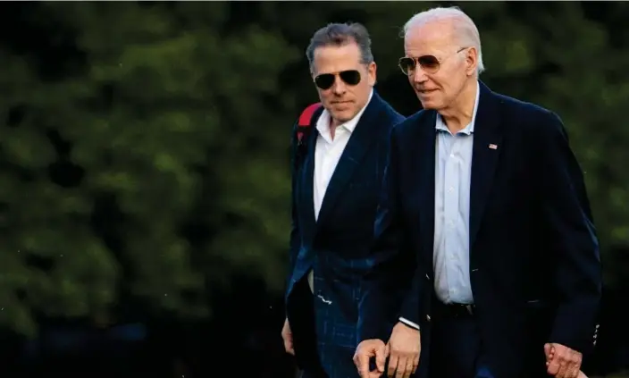  ?? Photograph: Andrew Harnik/AP ?? Joe and Hunter Biden in Washington in June last year.