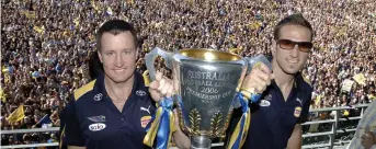  ??  ?? West Coast coach John Worsfold and captain Chris Judd with the 2006 Premiershi­p Cup