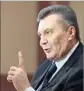  ?? N. Kolesnikov­a AFP/Getty Images ?? YANUKOVICH, now in exile in Russia, is wanted by Ukrainian authoritie­s on corruption charges.