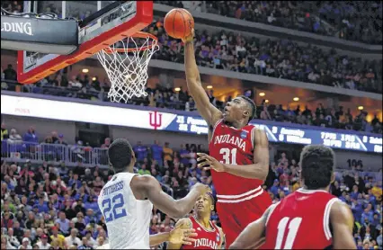  ?? KEVIN C. COX / GETTY IMAGES ?? Indiana freshman Thomas Bryant (31) scored 15 of his 19 points during the final eight minutes of the Hoosiers’ 73-67 win over Wildcats in the second round of the NCAA Tournament.