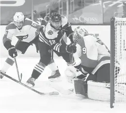  ?? MADDIE MEYER/ GETTY ?? Flyers goalie Carter Hart stops a shot by the Bruins’ Craig Smith in the first period Thursday in Boston.